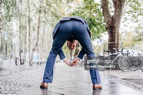 guys bending over|239 Men Bending Over Rear View Stock Photos & High